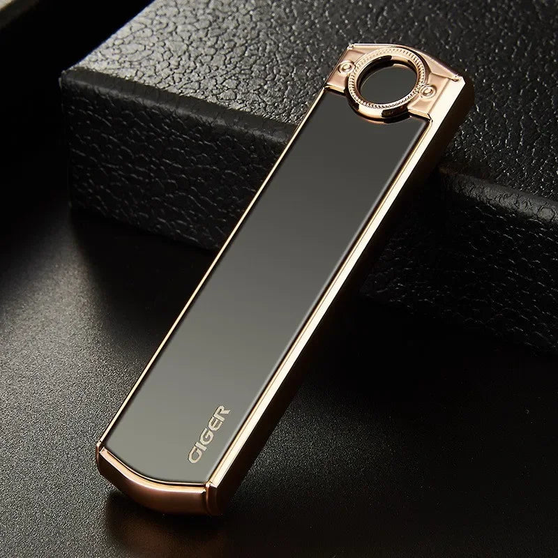 Black lighter with rose gold accents on a dark textured surface